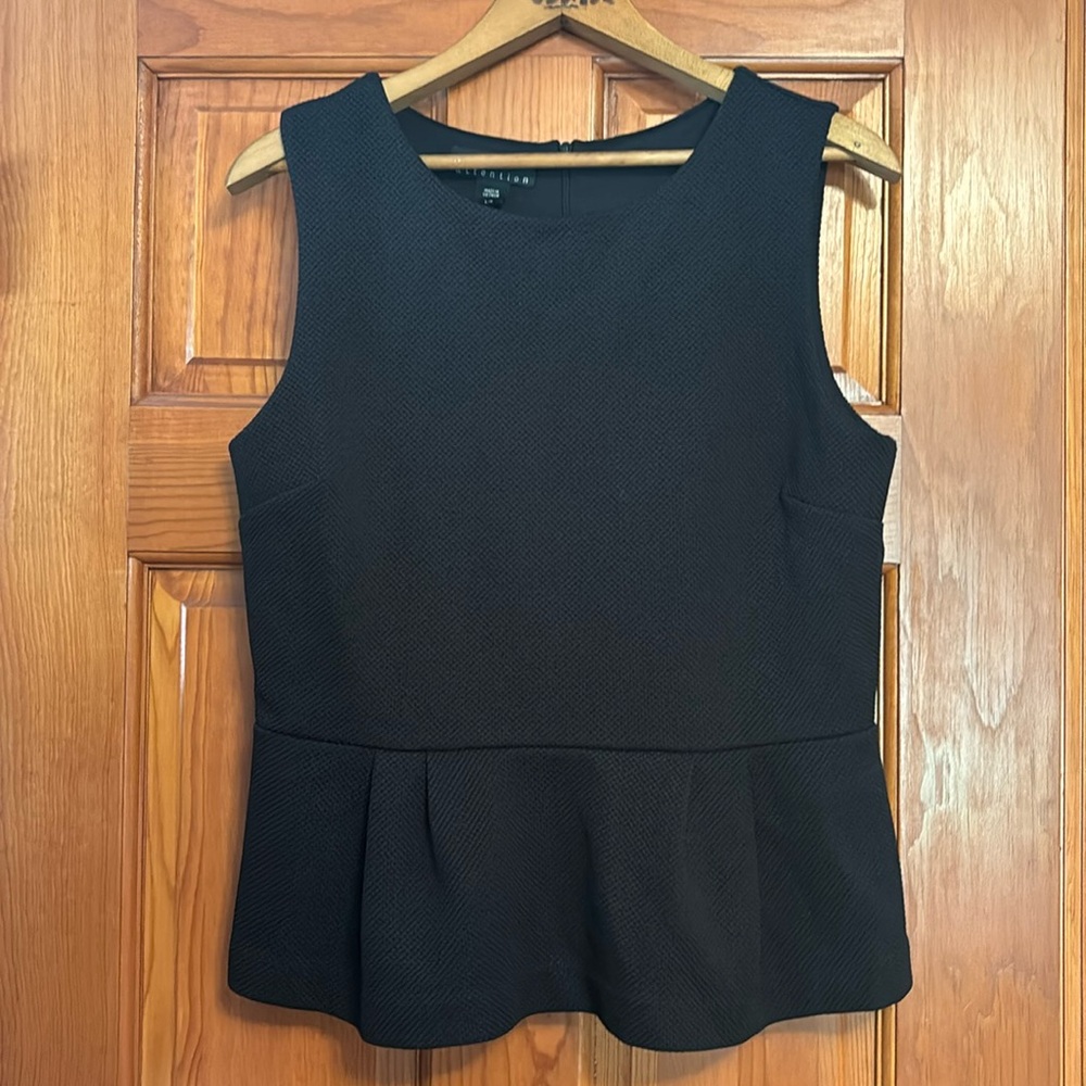 Black peplum lined top